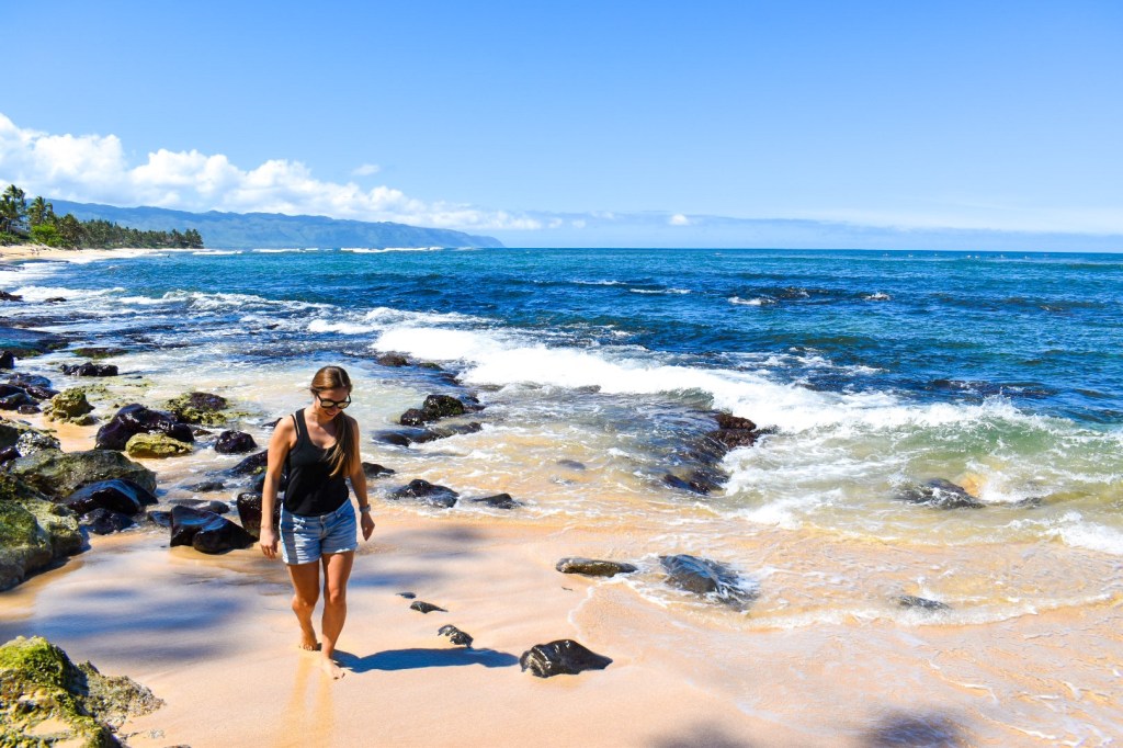 Enjoying an empty beach during our only sunny day on Oahu